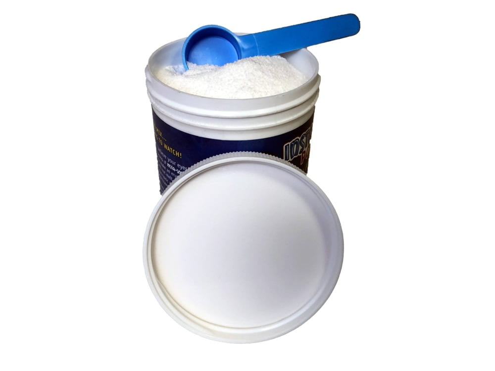 plastic container with powder and measurement spoon