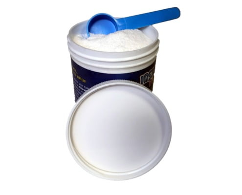 plastic container with powder and measurement spoon