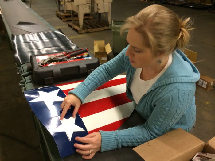 Finishing touches of a different style of a shield made of steel and shaped on a CNC press brake.